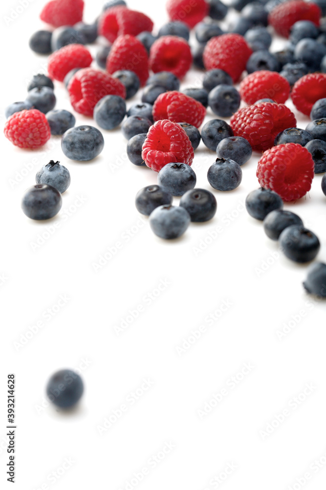 Raspberries and blueberries on white background Raspberries and blueberries on white background