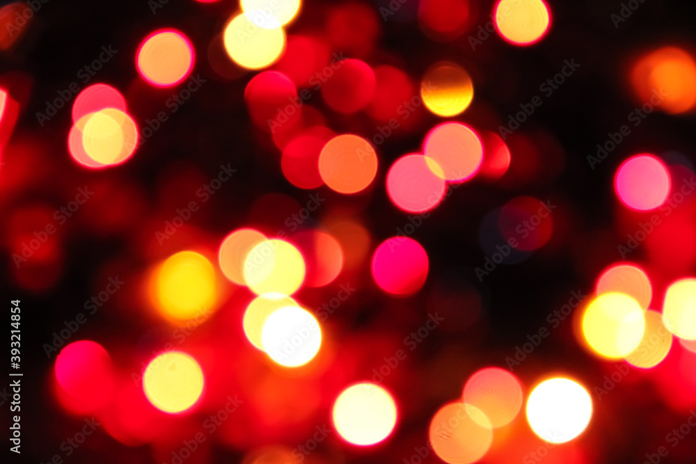 Abstract of colorful background. Bokeh light. shimmering blur spot lights on multicolored abstract background. Red pink yellow orange magenta. Christmas holiday