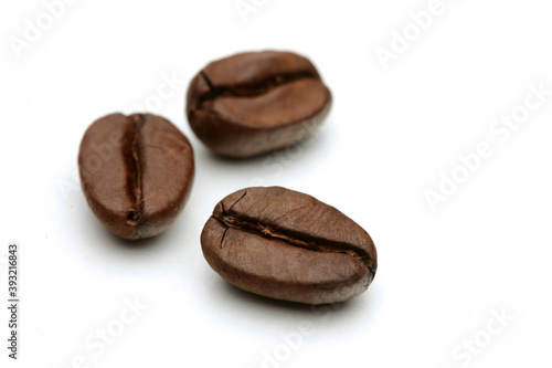 Close-up of coffee grains on white background