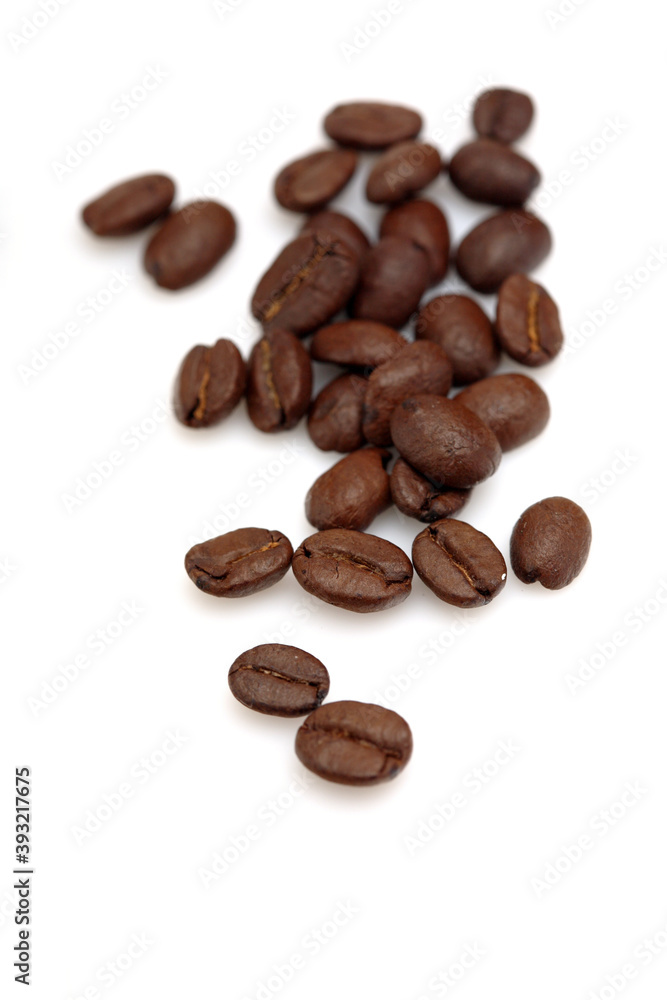 Fototapeta premium Coffee grains on white background