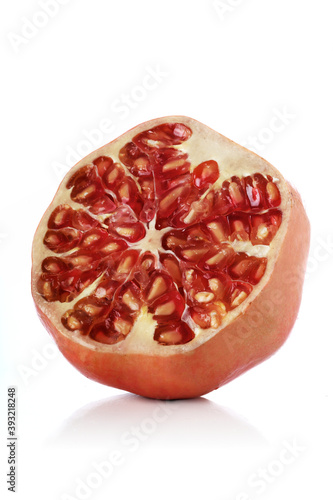 Pomegranate on white bacground - close-up