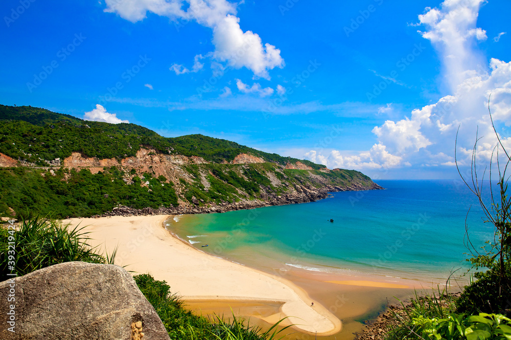 South Vietnam. Nha Trang. Blue lagoon. Beautiful landscape with sandy beach, turquoise water and green hill.
