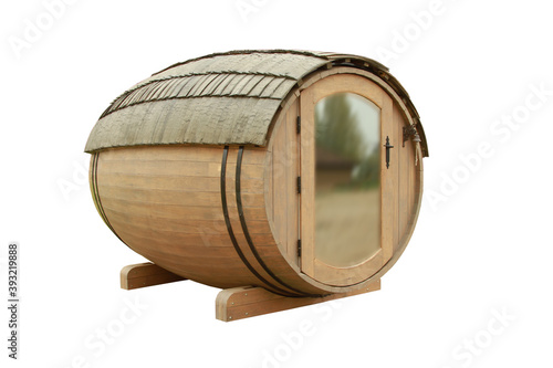 Wooden house in the shape of a barrel isolated on a white background photo