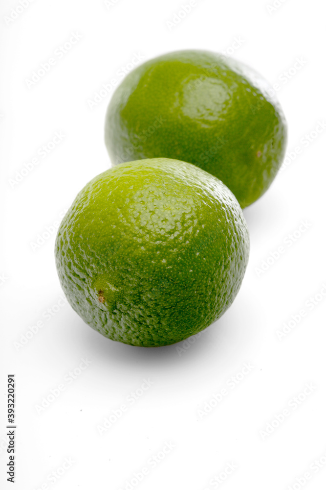 Limes on white background - close-up Limes on white background - close-up