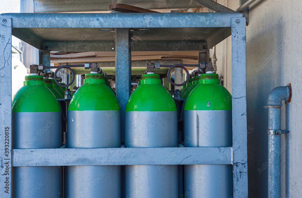 Gas industry, oxygen cylinders and pipes with valves. Gas industry, oxygen cylinders and pipes with valves.