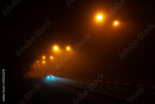 misty foggy road at night