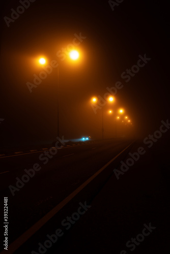 misty foggy road at night