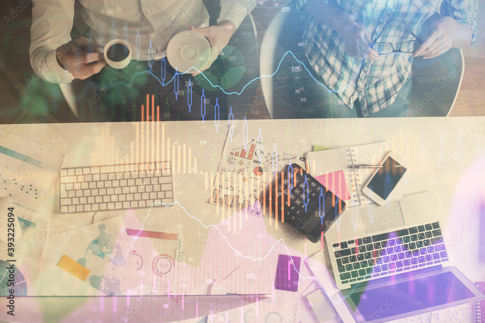 Double exposure of man and woman working together and financial chart hologram drawing. market analysis concept. Computer background. Top View. Double exposure of man and woman working together and financial chart hologram drawing. market analysis concept. Computer background. Top View.
