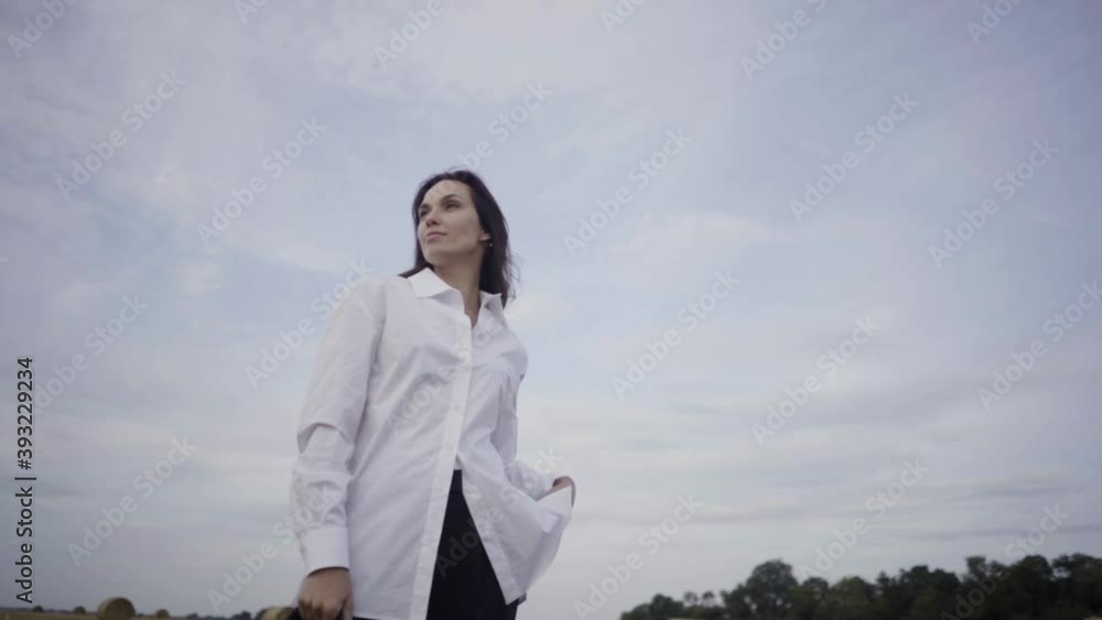 beautiful young girl walks across the field on a sunny day
beautiful young girl walks across the field on a sunny day