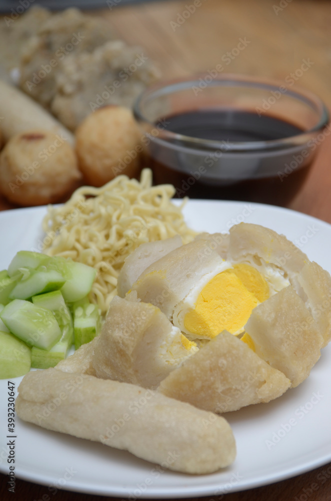 Pempek, mpek-mpek or empek-empek is a savoury Indonesian fishcake delicacy, made of fish and tapioca, from Palembang, South Sumatera, Indonesia. 