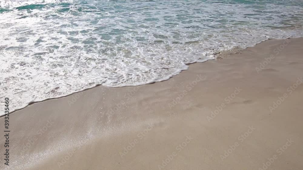 Surfing sea waves with foam on tropical sandy beach. Travel destinations. Caribbean nature Surfing sea waves with foam on tropical sandy beach. Travel destinations. Caribbean nature