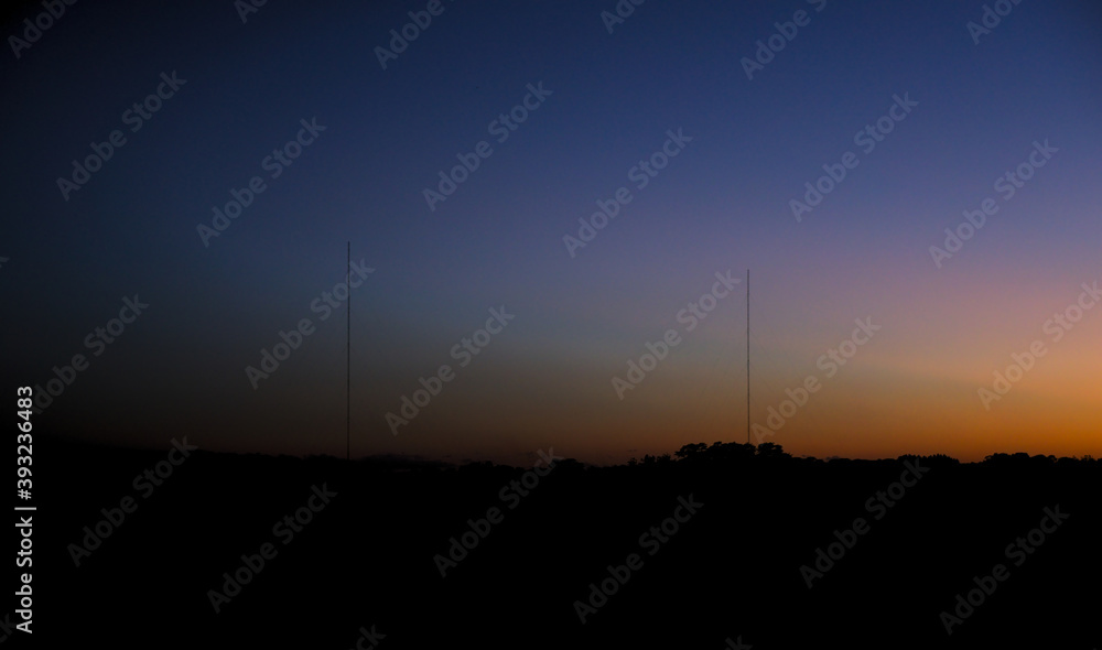 sunset with two antennas