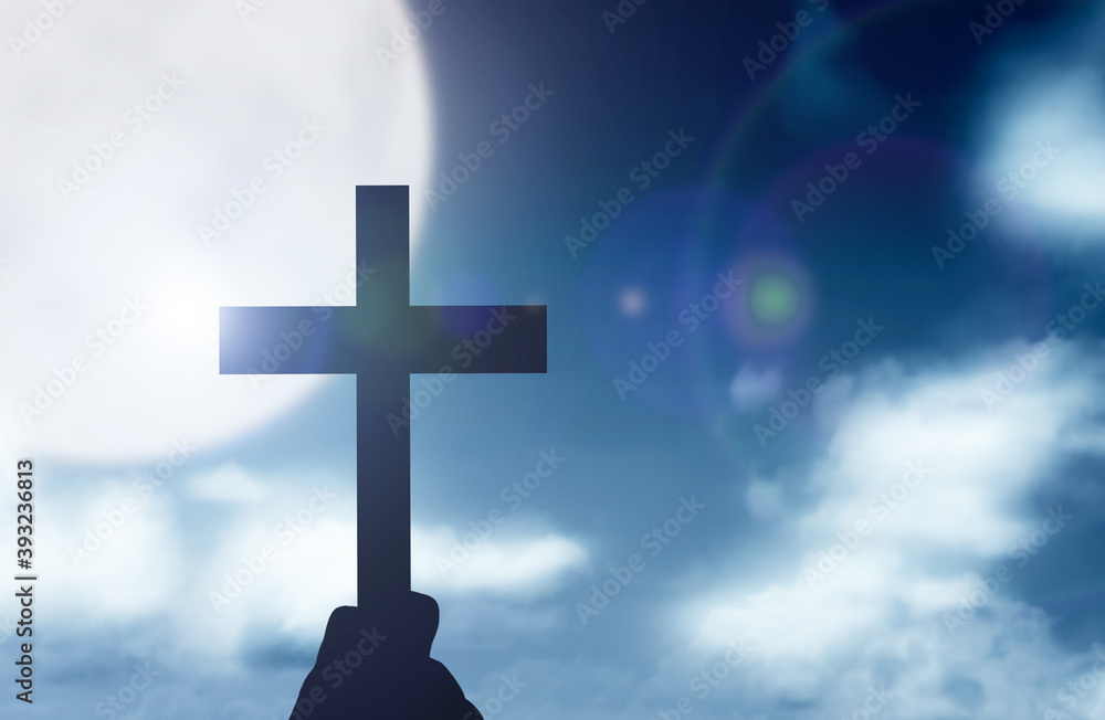 Human hand holding Christian cross Human hand holding Christian cross