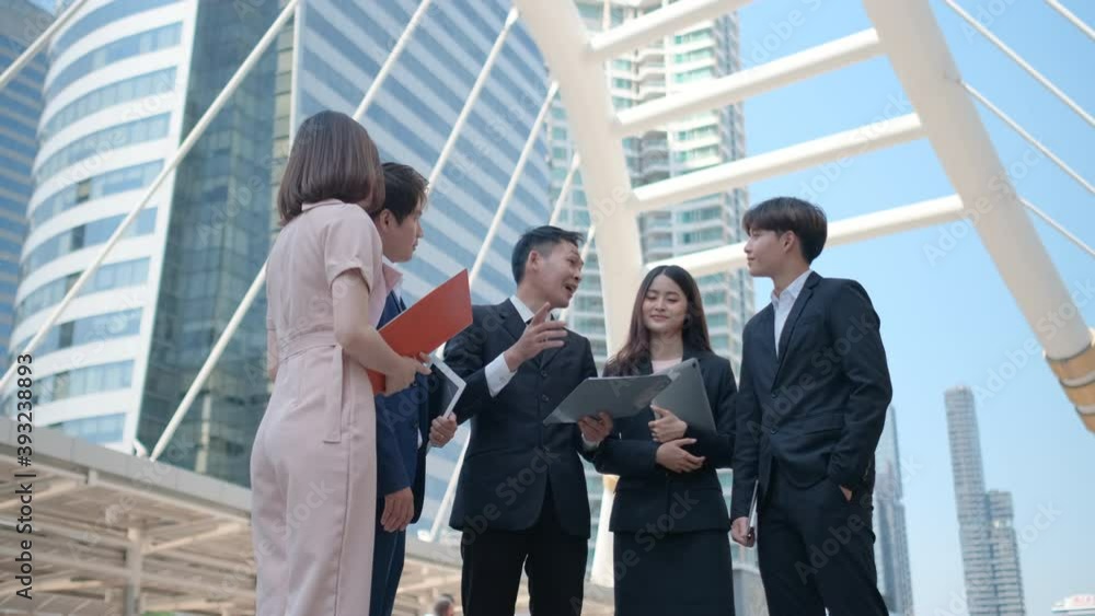 Group of business man and woman are celebrating and cheerful together after success of their project in big city. Concept of successful in business support staff good working. Group of business man and woman are celebrating and cheerful together after success of their project in big city. Concept of successful in business support staff good working.