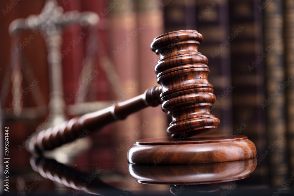 Law theme. Judge chamber. Judge’s gavel and collection of legal books
