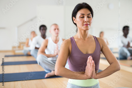 Positive people relaxing and enjoying yoga elements