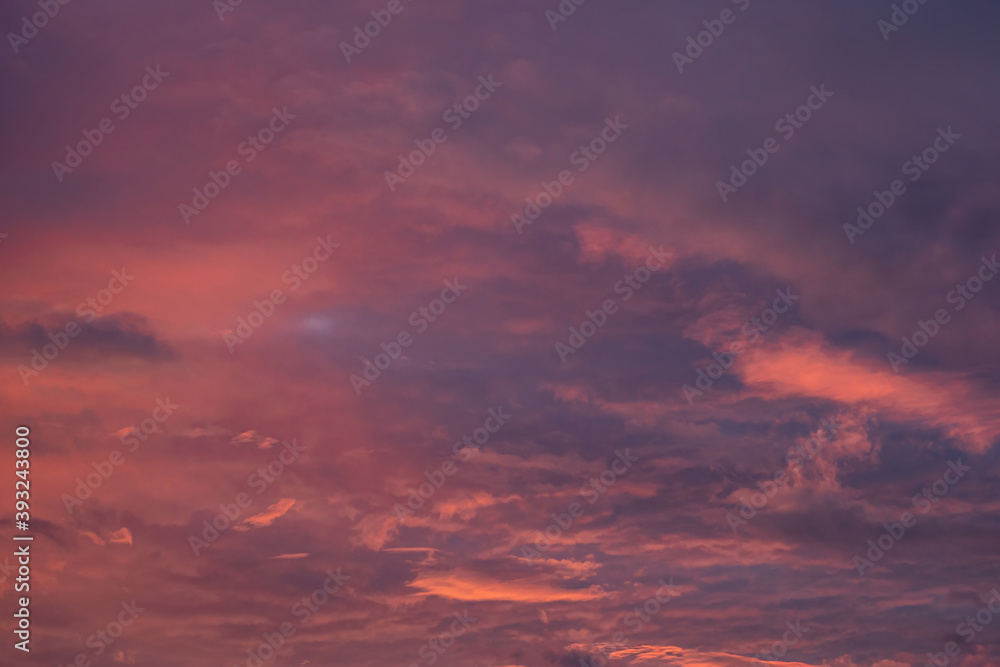 beautiful cloudy sky with pink, red orange and purple colour right after sunset