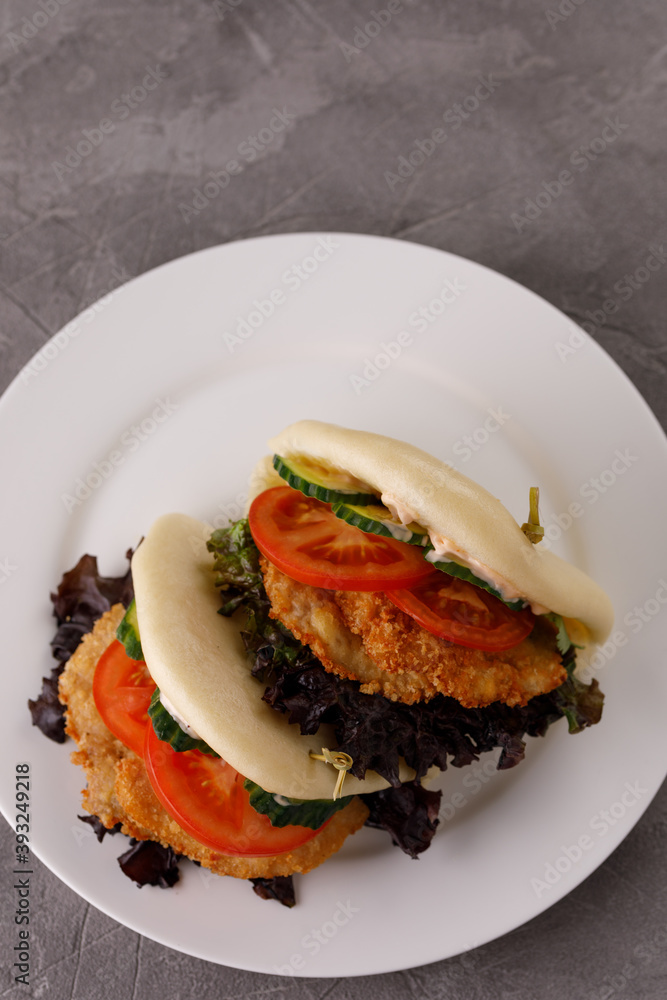 Steamed wheat bun dressed with designer sauce. Vietnamese cuisine concept. Still life. Close-up. Steamed wheat bun dressed with designer sauce. Vietnamese cuisine concept. Still life. Close-up.