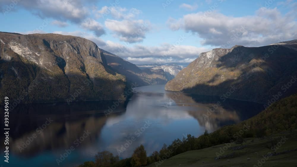 A view to a fjord with moving clouds and lambs in the foreground. Western Norway, time lapse video A view to a fjord with moving clouds and lambs in the foreground. Western Norway, time lapse video