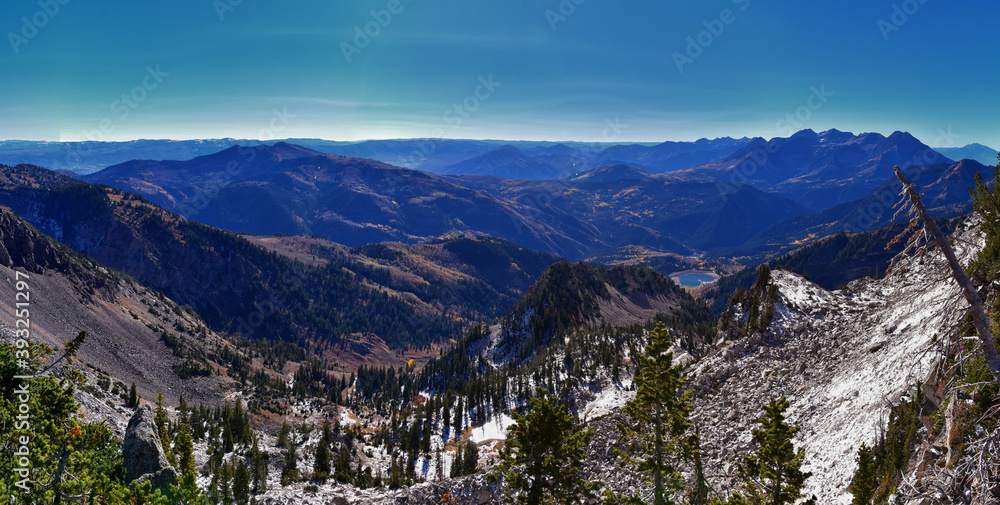 View of mountain landscape from White Baldy and Pfeifferhorn trail, Box Elder and Mill Canyon Peak, American Fork Canyon and Silver Lake in fall, Wasatch Rocky mountain range, Utah, United States. 