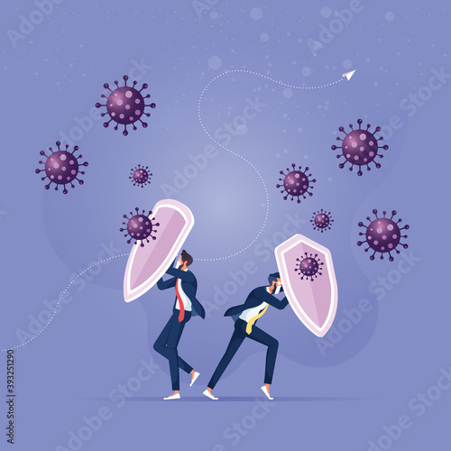 Fight and protect Coronavirus outbreak concept, Businessman holding shields and wearing to protect from COVID-19 Virus pathogens