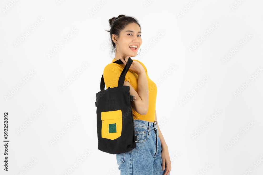 Portrait of young Asian woman holding tote bag canvas fabric over white isolated background. Portrait of young Asian woman holding tote bag canvas fabric over white isolated background.
