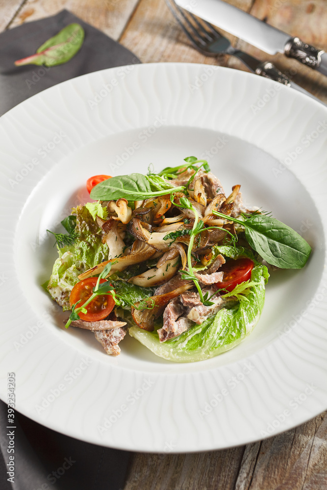 Oyster mushrooms and meat salad plate