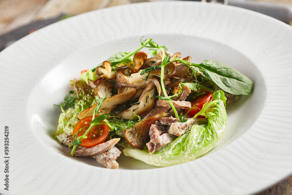 Oyster mushrooms and meat salad plate