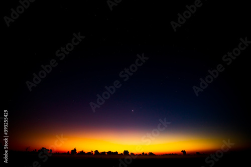 Night scenery with colorful and light yellow Milky Way Full of stars in the sky.