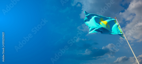 Kazakhstan national flag with blank text space on wide background.