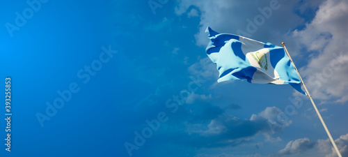 Guatemala national flag with blank text space on wide background.