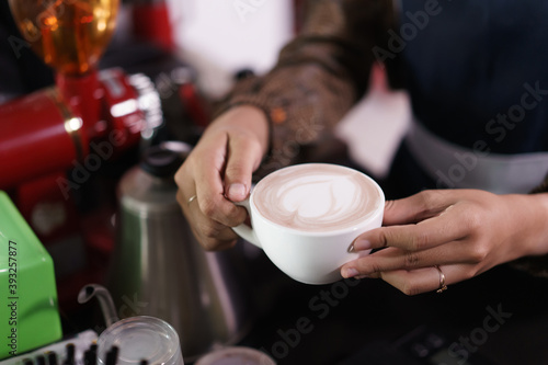 a cup of coffee is ready to be served and drink to customer