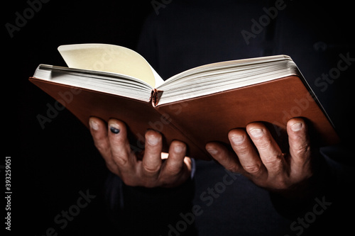 Open book in man hands. © alexxndr
