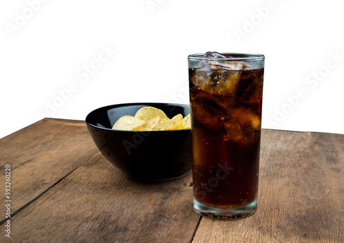 Drink cola with ice in glass in old wooden table on white background