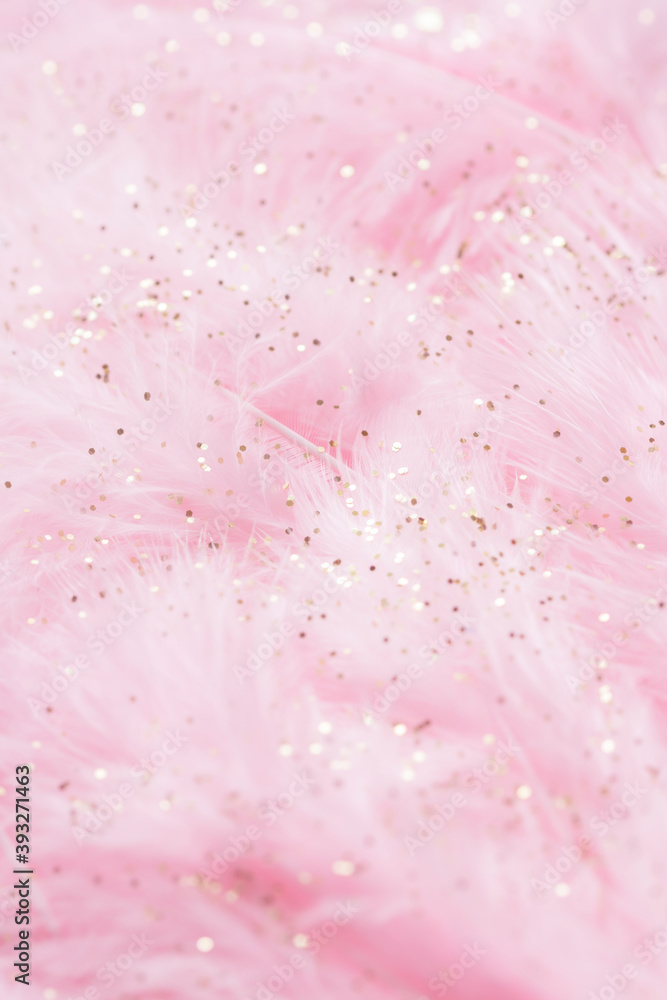 Fototapeta premium Pink fluffy feathers with gold glitter