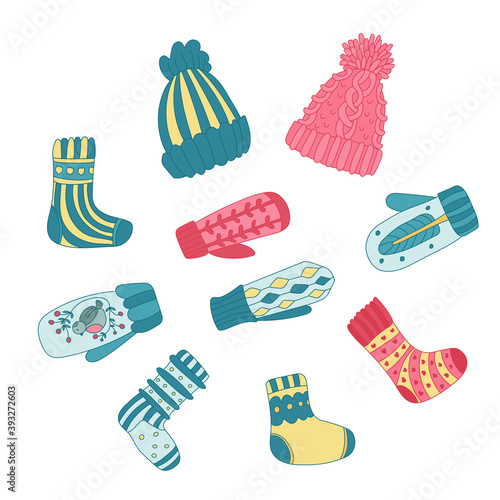 Color doodle set with cozy winter knitted clothes. Colorful cute hats, mittens, socks decorated with patterns. Hand drawn vector illustration isolated on white. Great for  winter cards, posters.