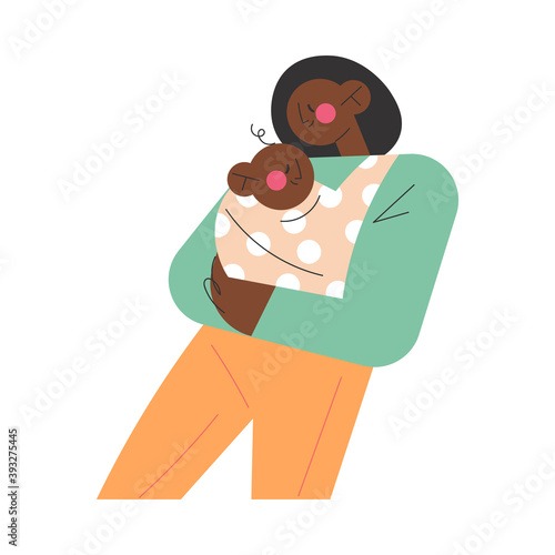 Young smiling black african woman mother carrying her small baby toddler in cotton sling