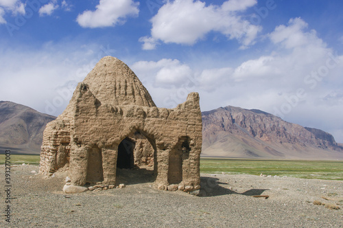 Landscape view of old caravanserai or Chinese tomb surrounded by mountains at Bash Gumbaz near Alichur, Gorno-Badakshan, Tajikistan Pamir photo