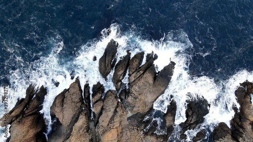 Ocean waves crashing into rocks