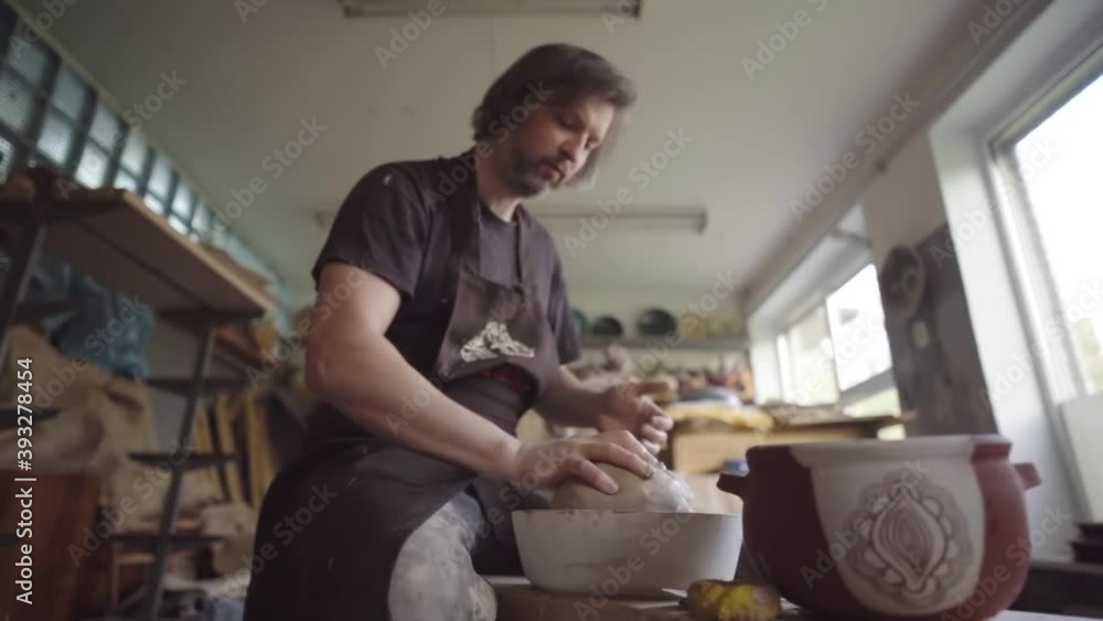 Potter at work. Ceramics studio. Potter at work. Ceramics studio.