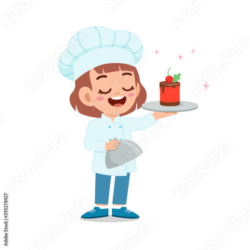 happy cute little kid boy and girl wear chef uniform and cooking a birthday cake