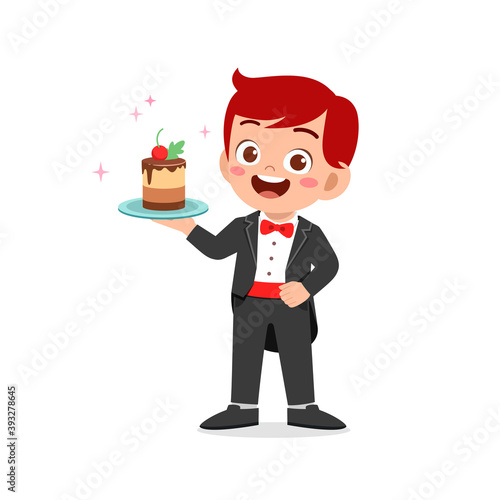 happy cute little kid boy and girl waring waiter uniform and holding birthday cake