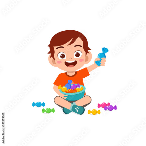 happy cute little kid boy and girl eat candy and sweets