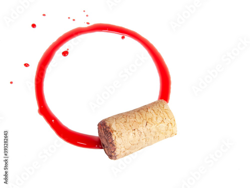 Wine cork and dirty red circle isolated on the white