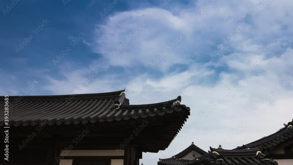 Korean Traditional House eaves with beautiful cloud moving. Korean Traditional House eaves with beautiful cloud moving.