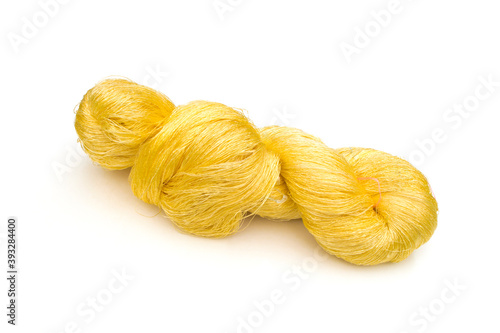 Yellow raw silk on white background.