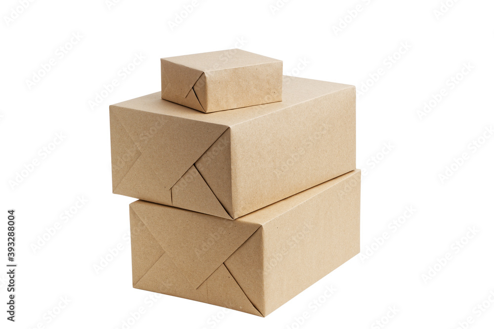 Closed brown cardboard boxes wrapped in kraft paper without label. Box for parcel, delivery or packaging isolated on white background. Closed brown cardboard boxes wrapped in kraft paper without label. Box for parcel, delivery or packaging isolated on white background.