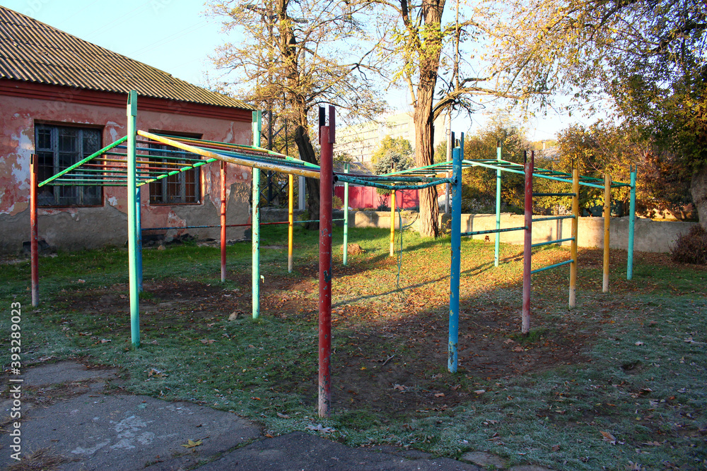 Children's painted playground, exercise equipment, horizontal bars for sports in the park