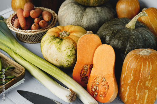 Wallpaper Mural Fresh pumpkin and leek on white table Torontodigital.ca