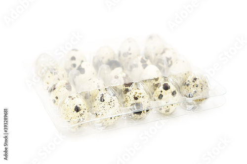 Organic quail eggs in plastic packaging isolated on white background. Сopy space on a white background	